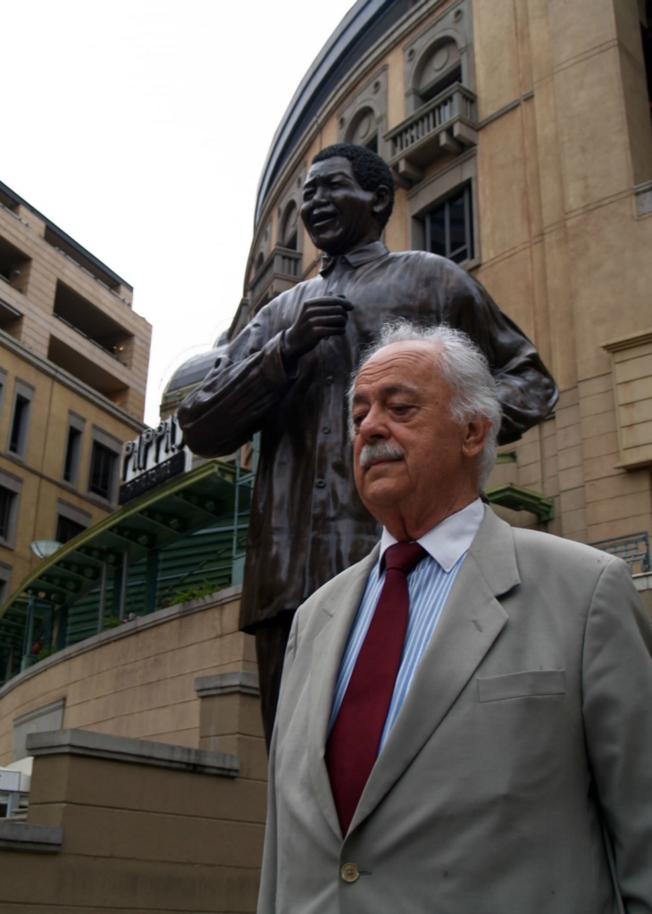 Advocate George Bizos, under Nelson Mandela statue